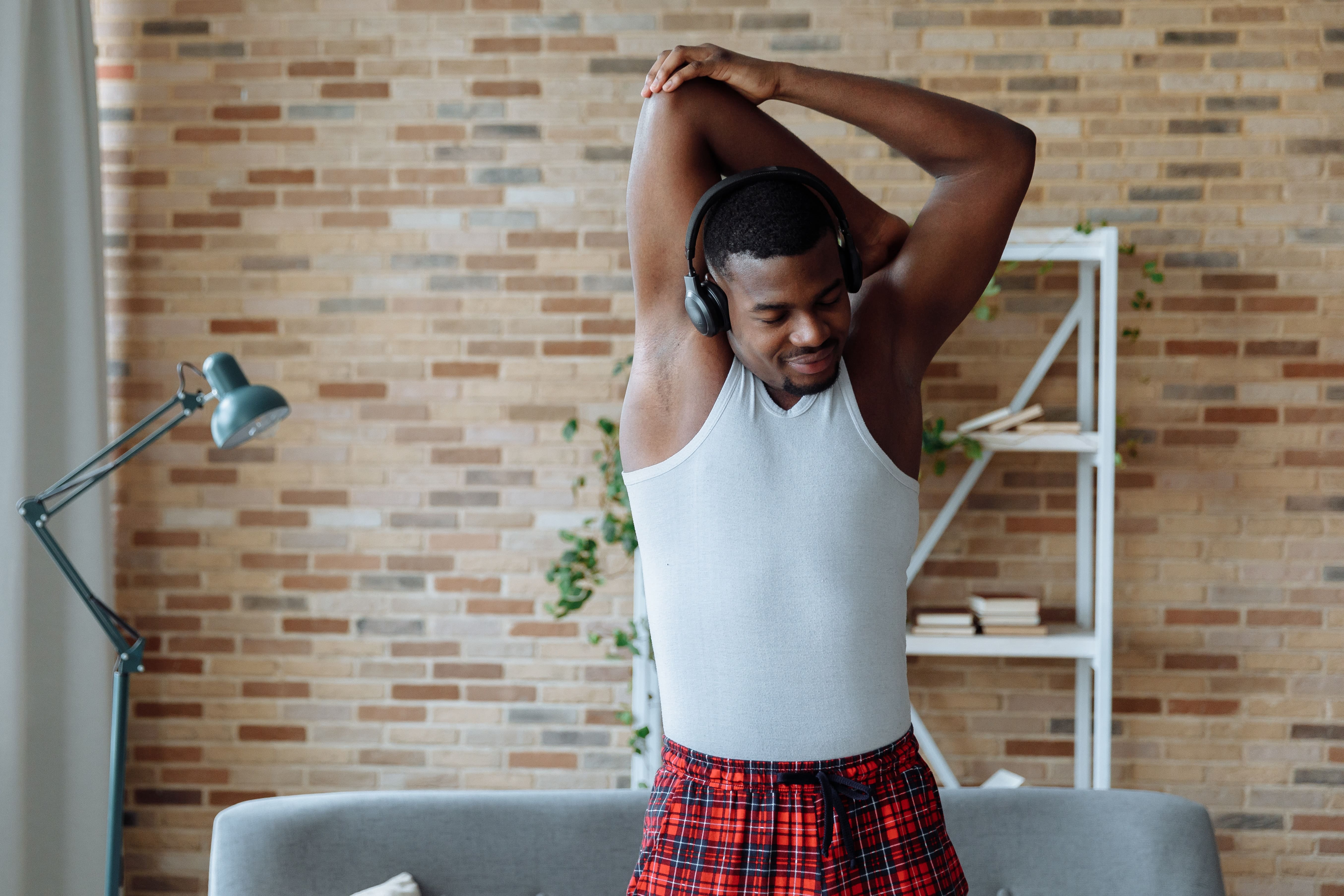 man stretching at home